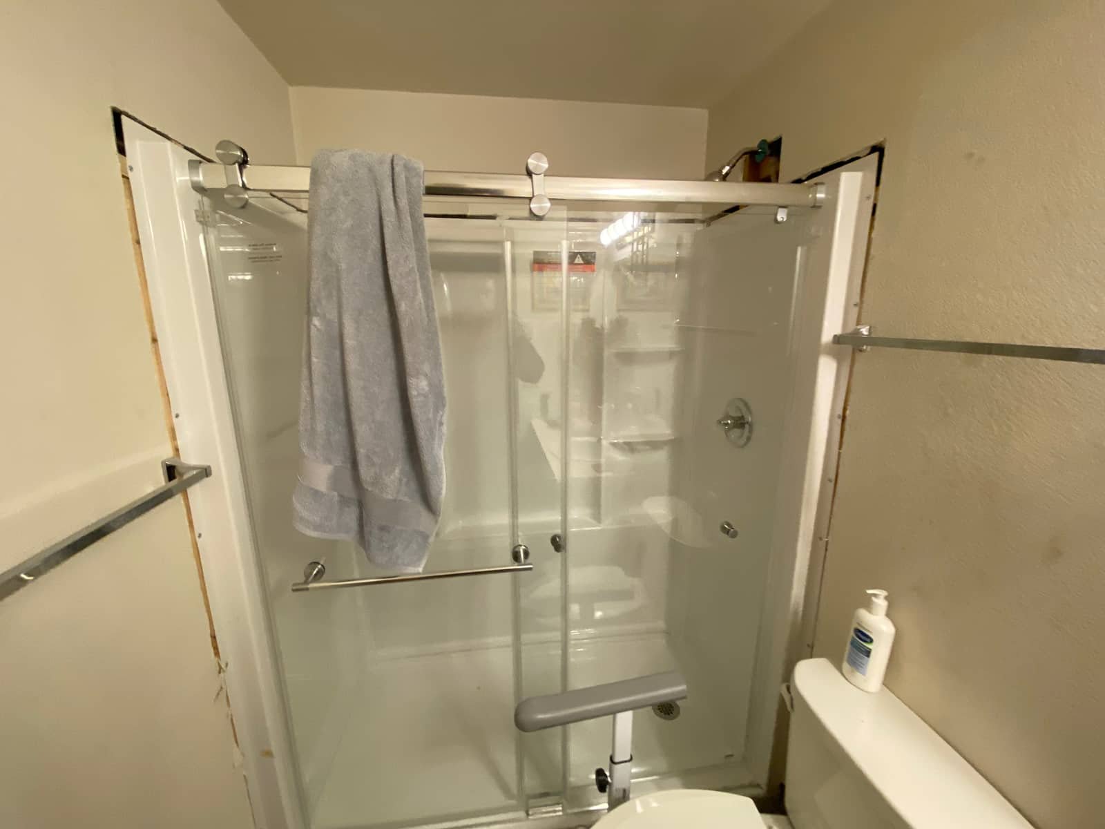 Finished glass shower door installed by Andy's Plumbing & Drain