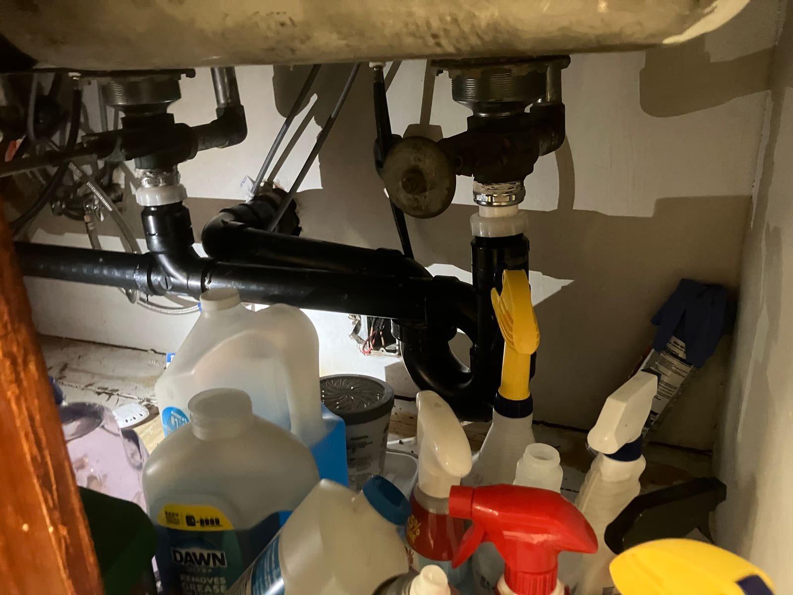 Under-sink drain plumbing cleared and reinstalled by Andy's Plumbing & Drain